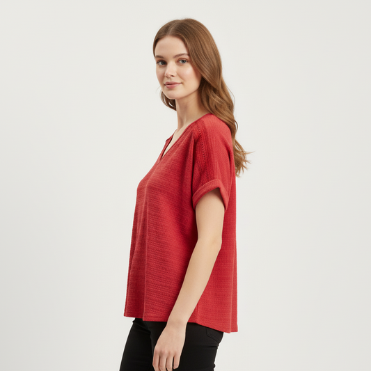Woman wearing a red top on a white background