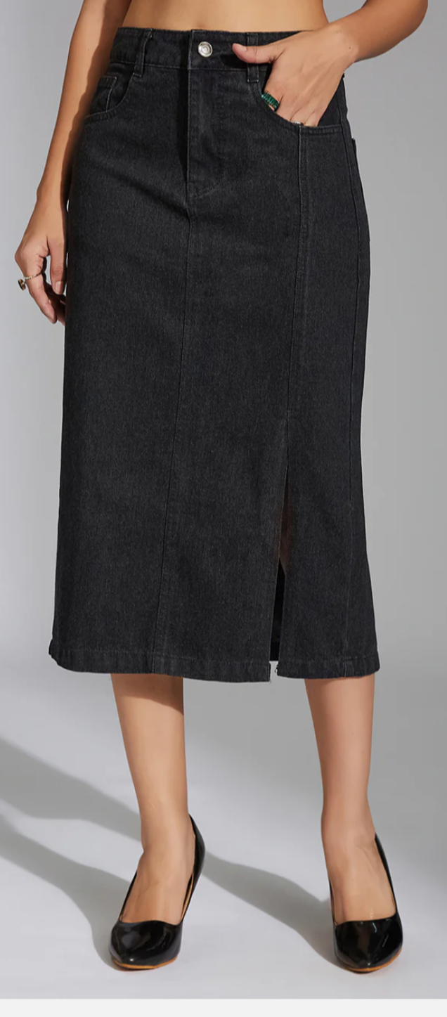 Black denim skirt worn by a person on a gray background