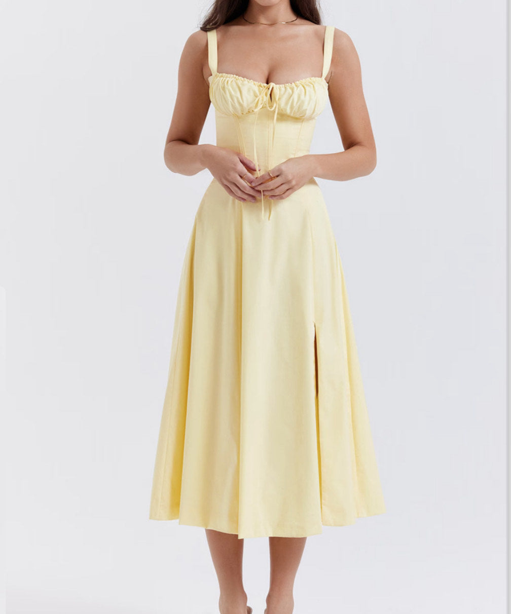 Yellow dress worn by a person on a white background