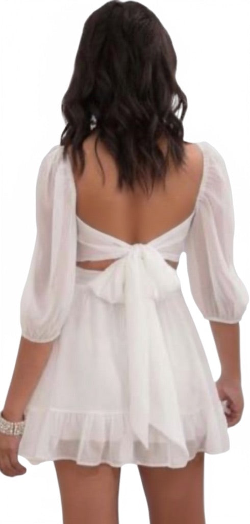 White dress with a bow detail on a white background