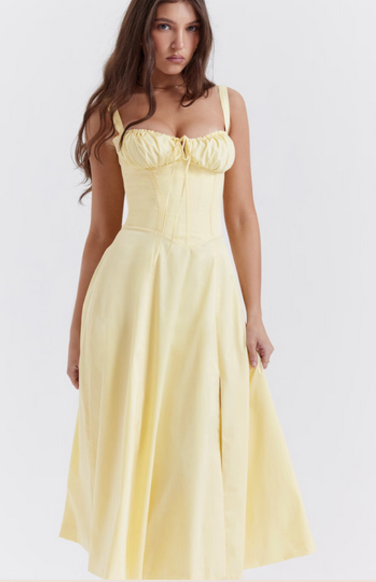 Woman wearing a yellow dress on a white background