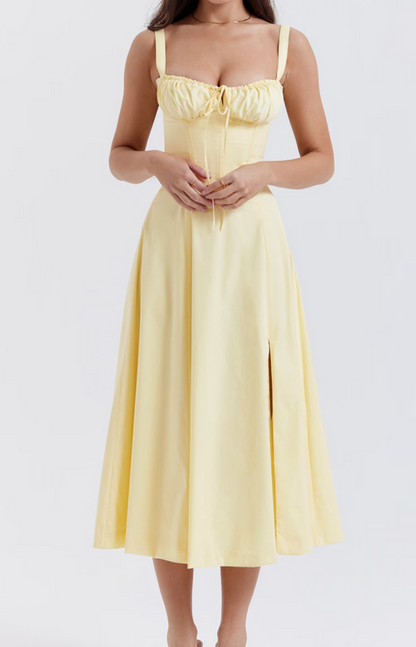 Yellow dress worn by a person on a white background