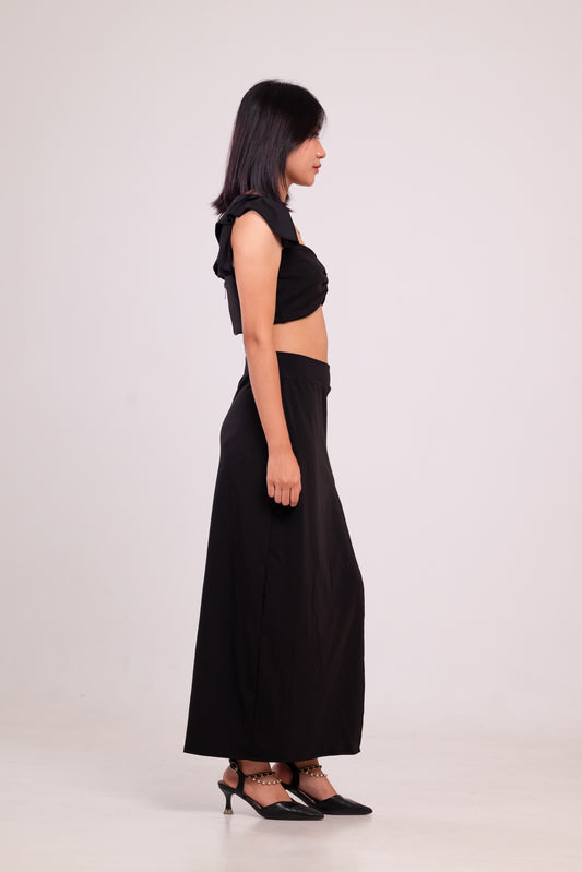 Woman wearing a black outfit on a white background