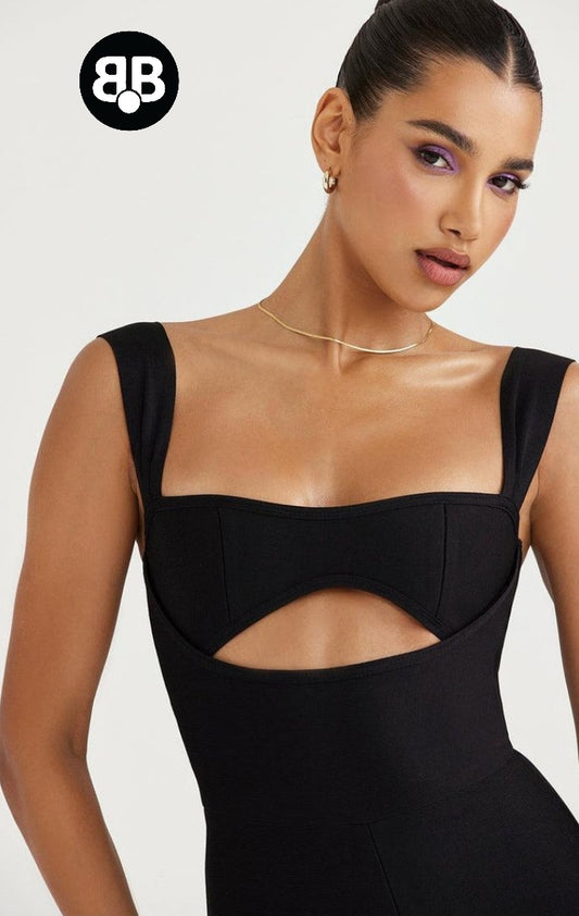 Woman wearing a black dress with cut-out design on a white background, featuring the brand logo.