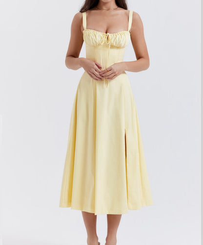 Yellow dress worn by a person on a white background