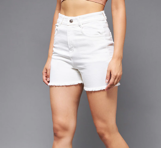White denim shorts worn by a person on a gray background